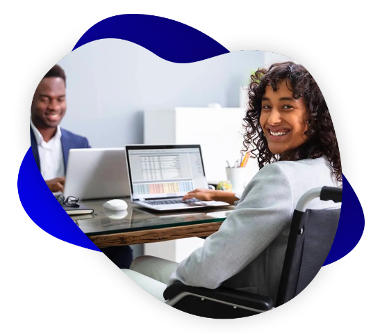 Man and woman sitting at desk with computers